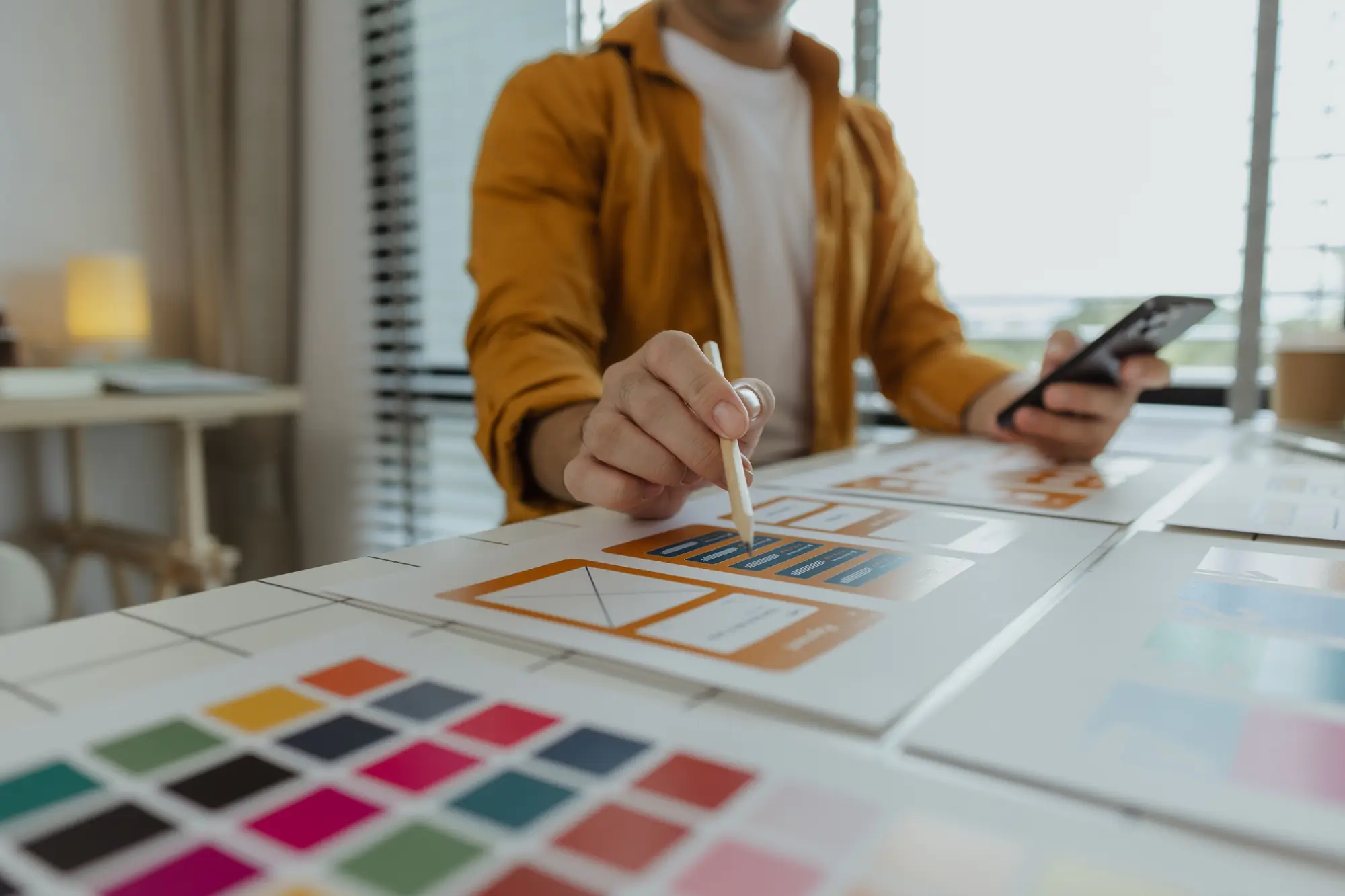 a web developer as a user experience and user interface officer is designing beautiful and easy to