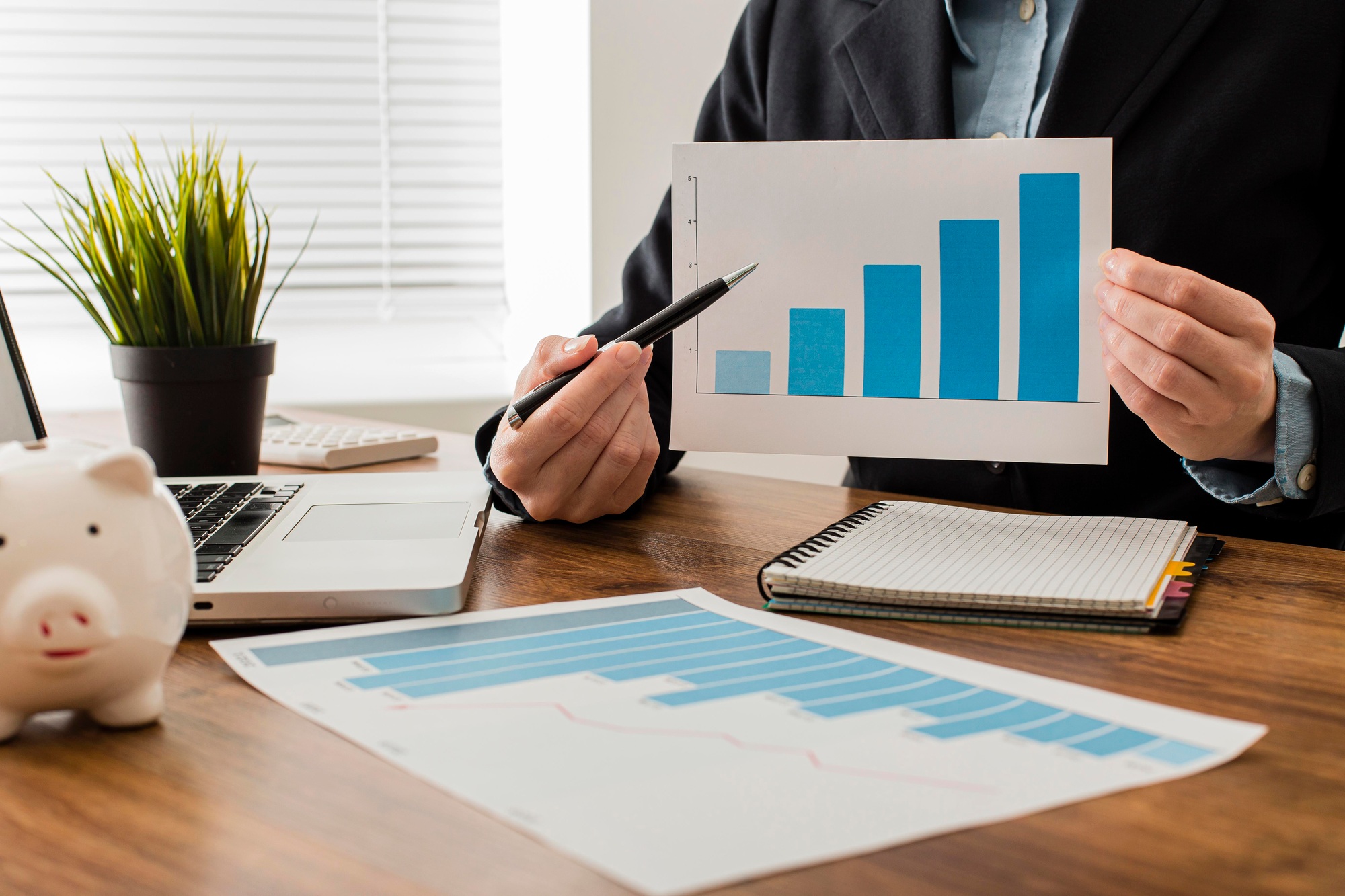 front view businessman holding growth chart