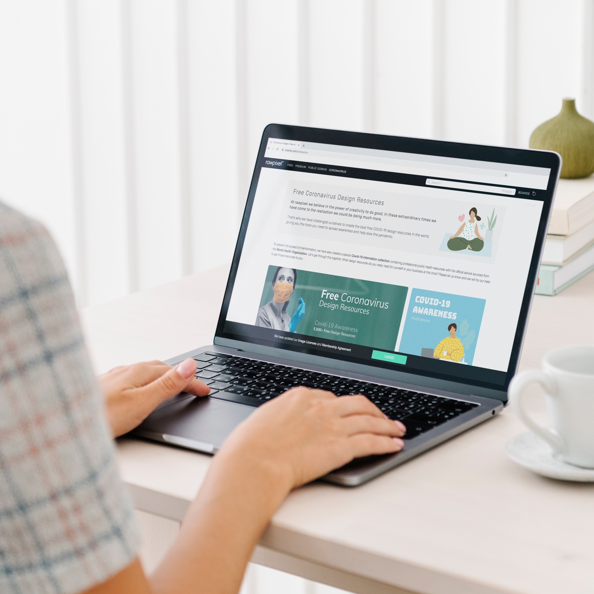 Woman checking out free design resources at a website